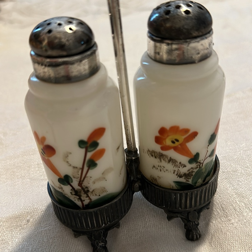 Antique salt and pepper shakers with stand